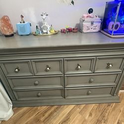 Baby dresser with changing pad topper