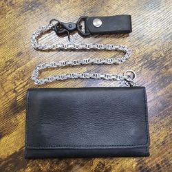 Brand new hand crafted genuine leather tri fold wallet with 24" stainless steel chain.

$75 FIRM