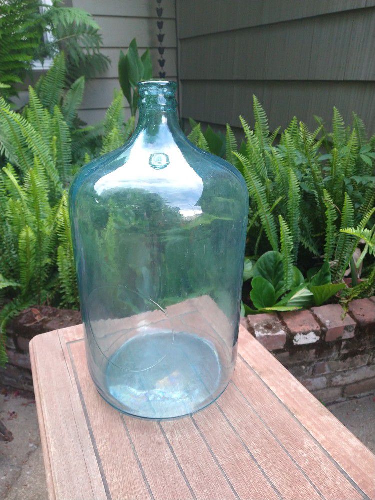 Vintage Blue /green glass water jug 5 gal.  Embossed "76" 