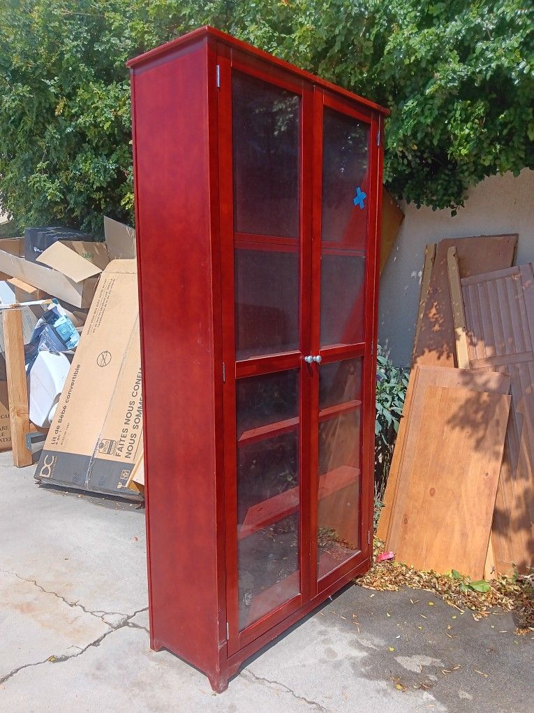 Red Mahagany look with 5 Shelves Behind 2 Glass Doors