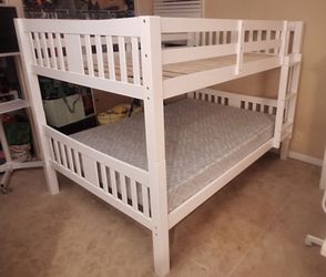 Full over Full bunk bed. Dark walnut,grey & white-$499. Full mattresses -$125.00 each. Assembly not included. Taxes included. Free delivery.  Se habla