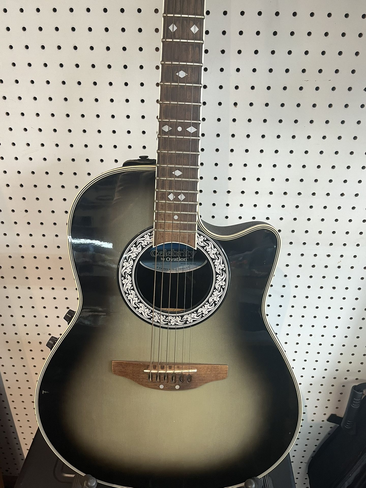 Electric/acoustic guitar.-