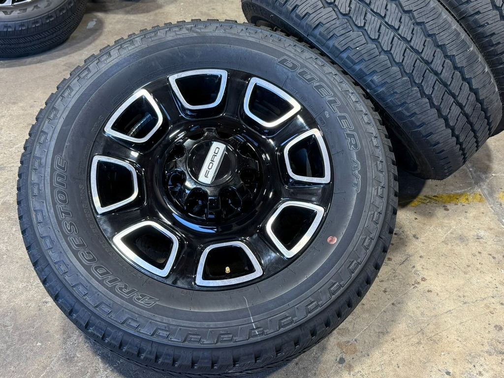 20" 2025 Ford F250 Platinum wheels Limited Gloss Black Machine Bridgestone AT LT275/65R20 100%