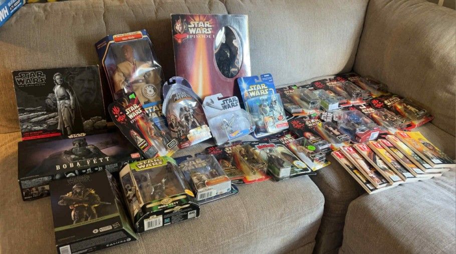  A Collection of vintage Star Wars action figures and TV Guide magazines, primarily centered around the release of Episode I: The Phantom Menace. 