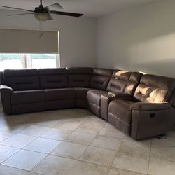 Brown couch sectional with leg rest