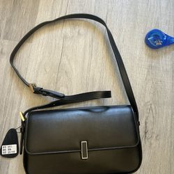 Black genuine leather women's crossbody bag.