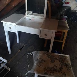 A Vanity With A Flip Down Mirror