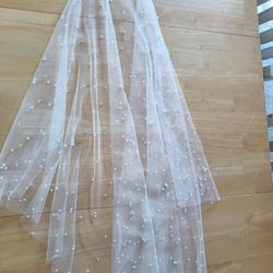 Bride accessories veil

Pearl Wedding Veil White Color hip Length made of tulle with pearl beads. Made with metal comb
Measurements
Width of comb 3.5 