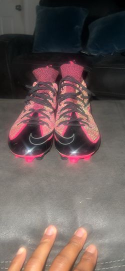 Nike black and pink football cleats