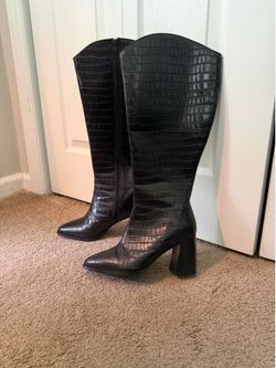 Woman’s black croc embossed faux leather knee-high riding zip boots