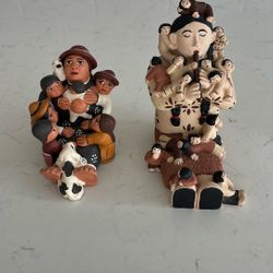 Two Storytelling Clay Statues