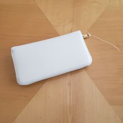WHITE WALLET WITH GOLD ZIPPER AND STRAP (NEW). $5