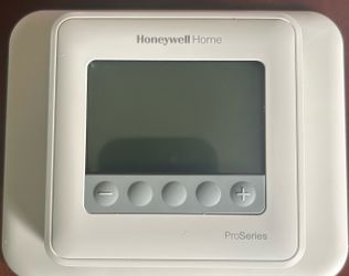 Honeywell TH4110U2005 T4 Pro programmable thermostat with added white wallplate