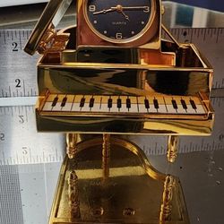 Timex quartz watch on gold (not real gold) piano