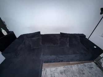 L shaped black sofa