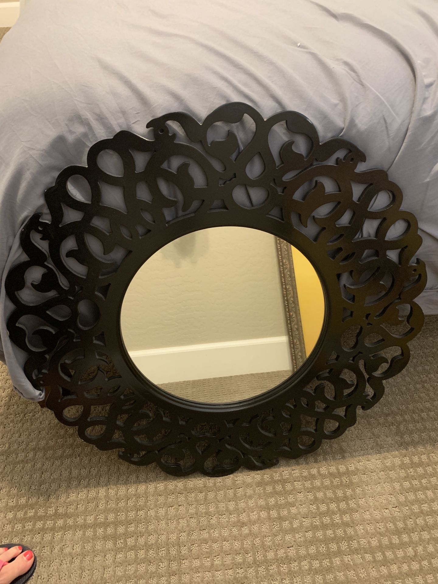 Black circular wall mirror