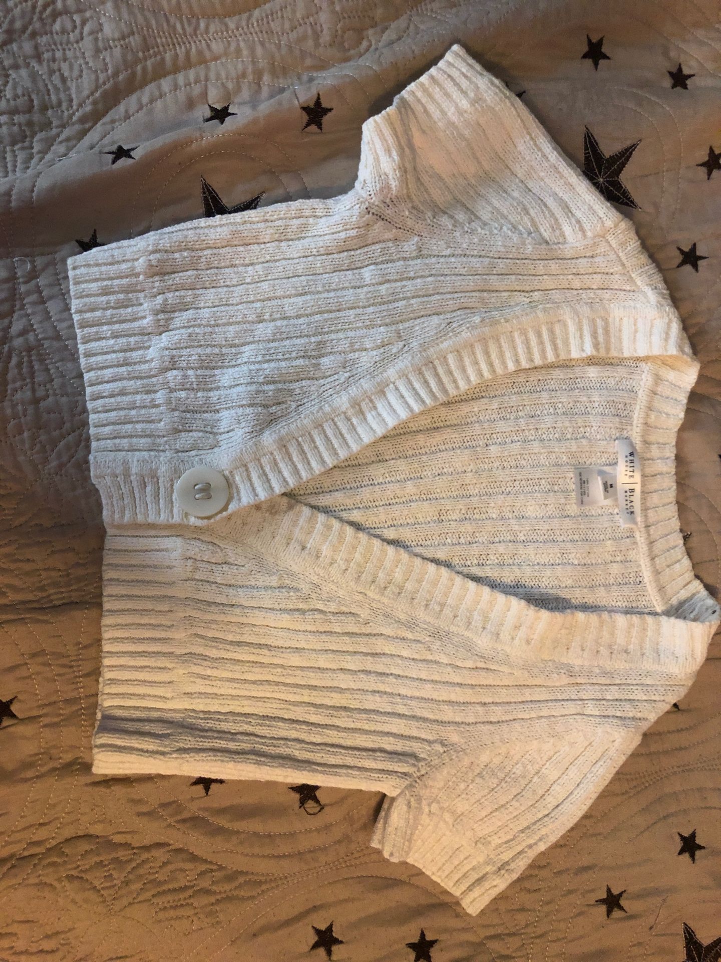 White and black house vest