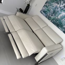 White Real Leather/Vinyl Power Reclining Sofa Loveseat Excellent Condition. Adjustable Headrest / Footrest. Dimensions: 83W x 33H x 43.5L. Was $2,400