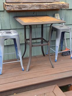 Cafe height patio table and stools