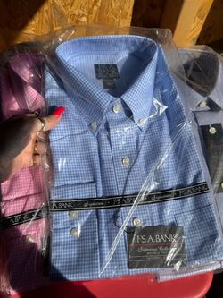 12 shirts new in packaging with tags