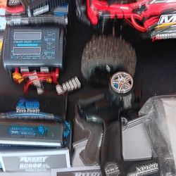 Rival monster truck with remote and extra battery  and charger. Also some tools.