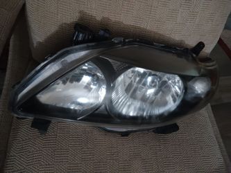 2009 Corolla Left Driver Headlight also fits 2010