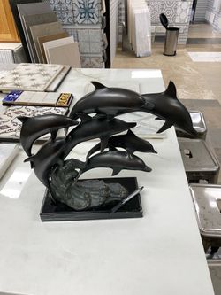 “Stunning, bronze, dolphins, the perfect beach decor!“