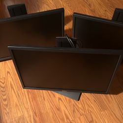Three used Dell P2217 monitors.