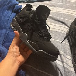 black cat Jordan fours