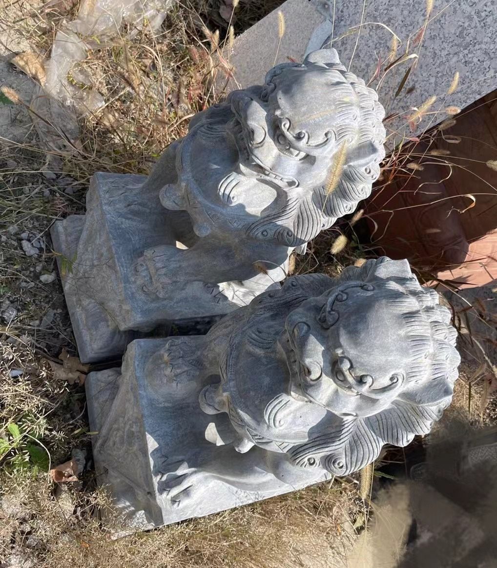 Sculptured stone lions 2’ tall.