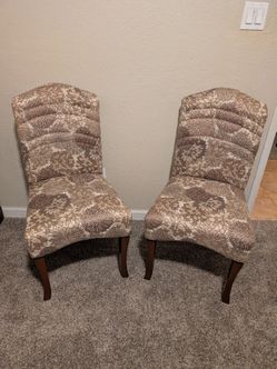 Two  Ashley Furniture Accent Chairs