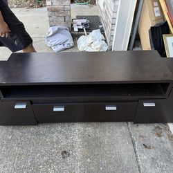 Contemporary style TV stand Two open shelves with rear wiring access Two side cabinets and two drawers on double metal glides Available in two beautif