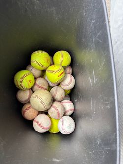 BUCKET OF BASEBALLS AND SOFTBALLS