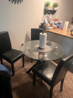 Glass dining room table and chairs