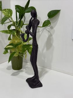 Very heavy cast metal trumpeter