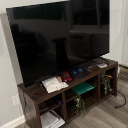 TCL TV with wooden TV stand
