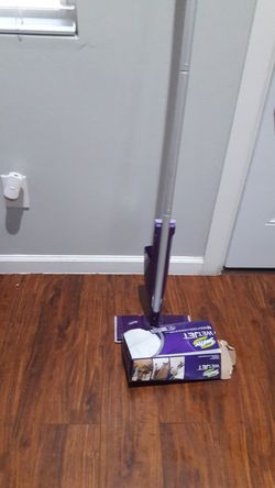 Swifter with a swifer pads