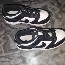 Black and white children's size 10 Nike low top