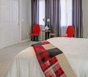 Two Red Chairs With Metal Legs 