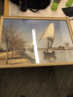 brown framed two sailing boats on river photo