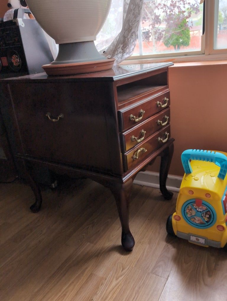 A Little Cabinet With Four Little Tables Inside