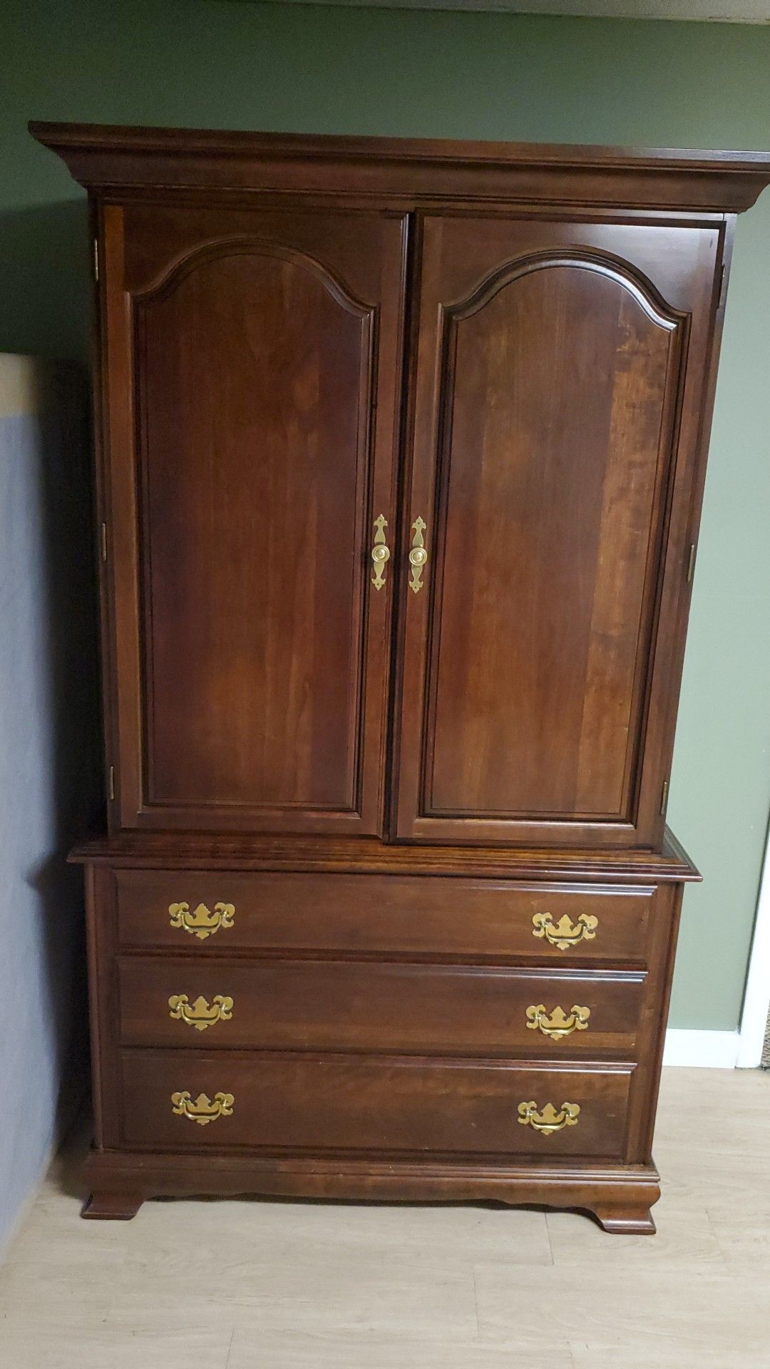 Cherry wood Armoire and cherry wood dinning table.