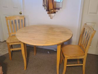 Light Wood Drop-Leaf Dining Table and 2 Chairs. 42" diameter.