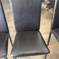 3 Faux Black Leather Chairs at $10 Each.
