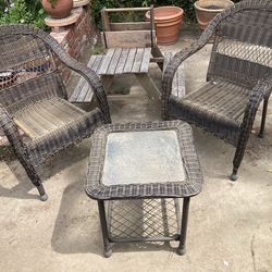 Three Piece Rattan set. Two chairs One glass table