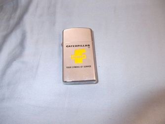 vintage collectible caterpillar fabick zippo lighter from the 1970s, new never used