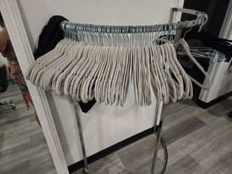 Clothes hanger rack and 75 beige hangers