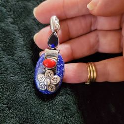 Silver Flower Pendant With Blue Topaz