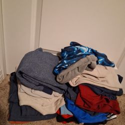 Stack Of Clothes And Shoes