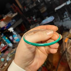 Lia Sophia crystal inset green enameled silver-tone metal 2.5" diameter stretch bangle bracelet. 